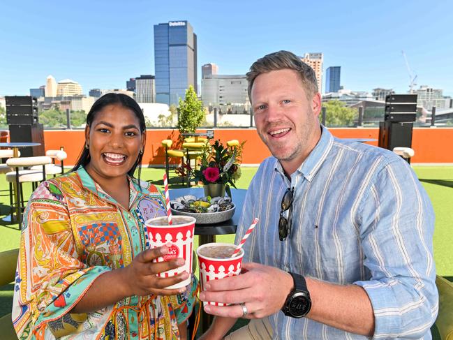 DECEMBER 4, 2024: SACA members John Hinge and Hannah Douglas-Hill enjoy Pimms and oysters on the new Village Green for members at the Lindsay Head Terrace on Level 5 of the Riverbank stand. Picture: Brenton Edwards