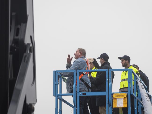 Hospice manager Mark Munro (left) reacts as the scissor lift ascends during Hang Ya Boss Out To Dry for the Toowoomba Hospice, Friday, May 31, 2024. Picture: Kevin Farmer