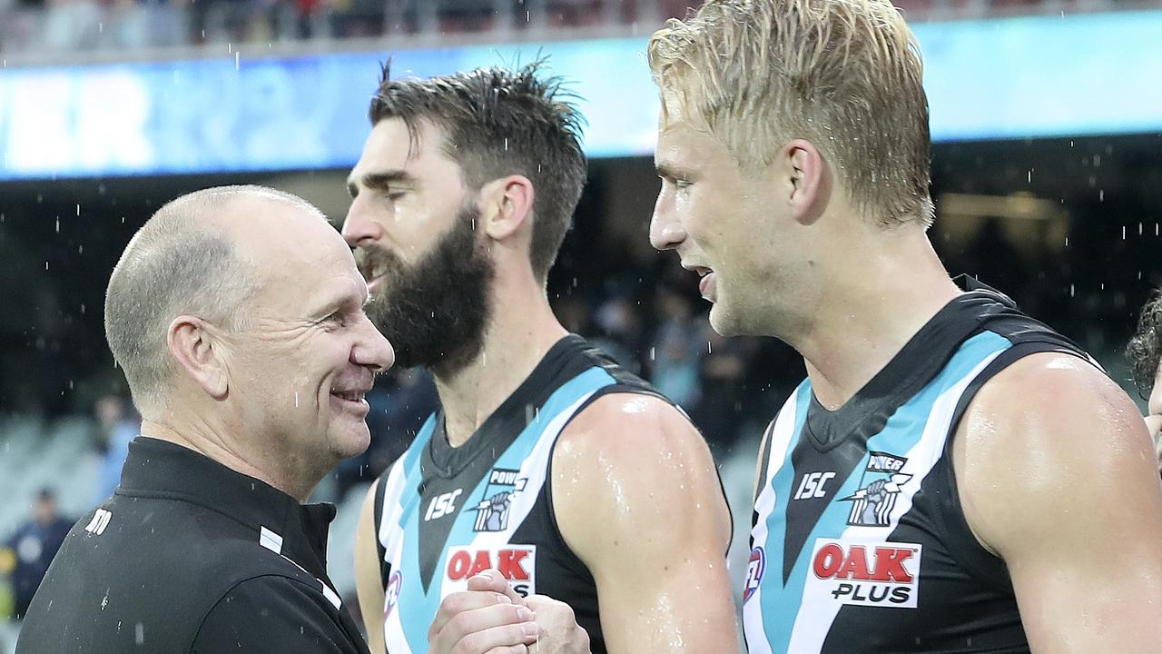 Ken Hinkley congratulates Billy Frampton after Port Adelaide’s win. Picture: Sarah Reed