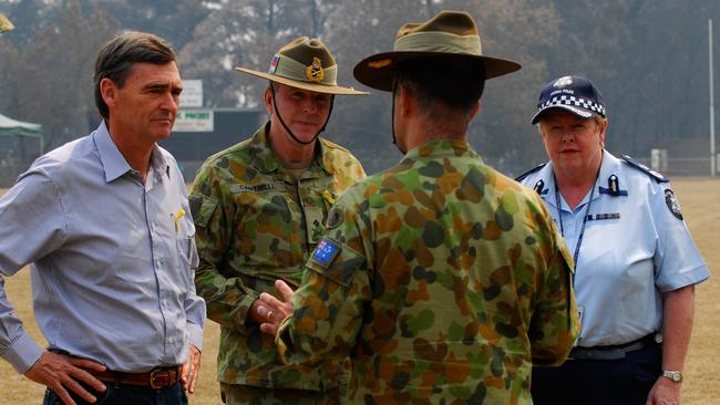 oint Task Force 662 Commander, Brigadier Michael Arnold, updates the Victorian Premier, the Hon. John Brumby, Major General John Cantwell, AO, and Victoria Police Chief Commissioner Christine Nixon in 2009. Picture: Ricky Fuller