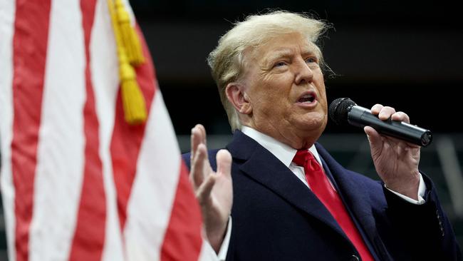 Former president Donald Trump speaks to voters during a visit to a caucus site at the Horizon Event Center in Clive, Iowa. Picture: Kevin Dietsch / Getty Images via AFP