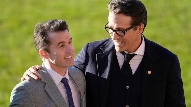 Rob McElhenney and Ryan Reynolds welcome the arrival of King Charles III and Camilla. Picture: Getty Images