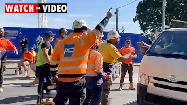 Protesting construction workers in heated dispute with motorist