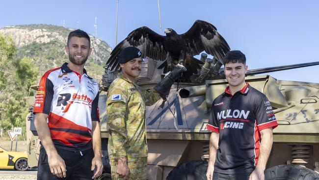 Supercars drivers Andre Heimgartner and James Golding with Courage the eagle from 2nd Cavalry Regiment at Lavarack Barracks in Townsville ahead of the NTI Townsville 500. Picture: Mark Horsburgh / Supercars Media