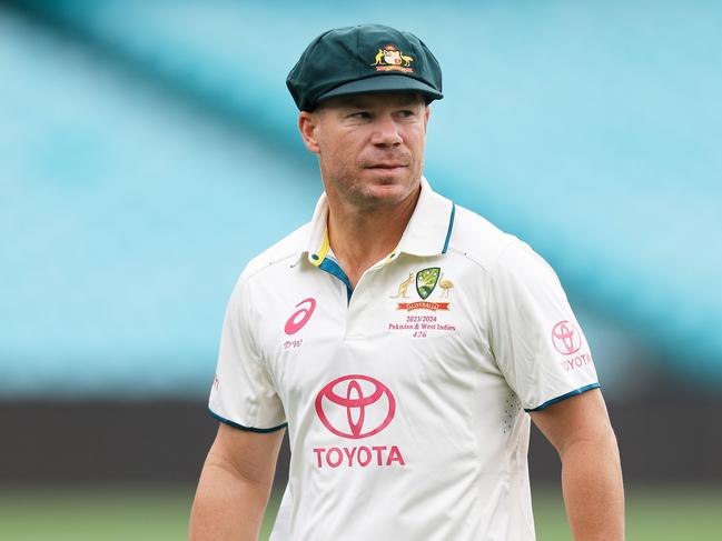 SYDNEY, AUSTRALIA - JANUARY 01: David Warner of Australia checks out the pitch ahead of the Third Test Match between Australia and Pakistan at Sydney Cricket Ground on January 01, 2024 in Sydney, Australia. (Photo by Mark Evans/Getty Images)