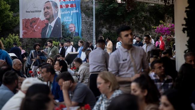 Election campaign posters remind diners at a Istanbul restaurant of Turkey’s presidential runoff election. Picture: Getty Images