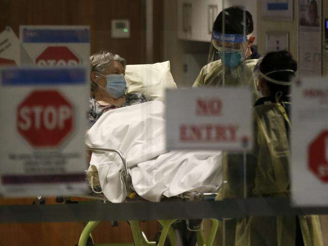 MELBOURNE, AUSTRALIA - JULY 28: A resident of Epping Gardens Aged Care Facility is taken away in a ambulance on July 28, 2020 in Melbourne, Australia. Victoria has recorded 532 new cases of coronavirus and six more deaths, yesterday making it the worst day of the pandemic. Metropolitan Melbourne and the Mitchell shire remain in lockdown due to the rise in COVID-19 cases through community transmissions, with people permitted to leave home only for exercise, work, to buy essential items, or to access childcare and healthcare and individuals are required Face coverings or be subject to a $200 fine. Lockdown measures are in place until August 19. (Photo by Darrian Traynor/Getty Images)