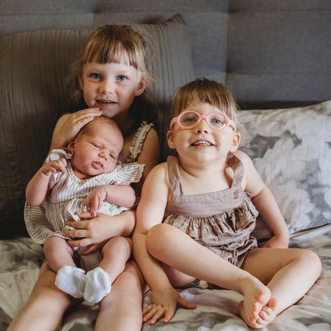 Sisterly adoration … the Flynn sisters Hayley, 5, with Harper, 3, and Madison, eight months. Picture: Deane Woods photography