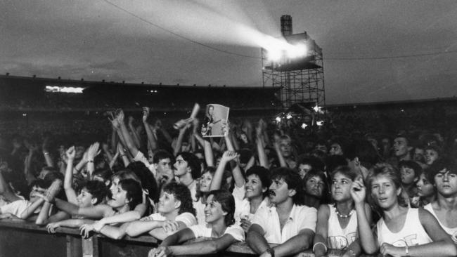 Crowd of people watch British rock band Dire Straits play a concert at Football Park, West Lakes, 12 Feb 1986. (Pic by unidentified staff photographer)