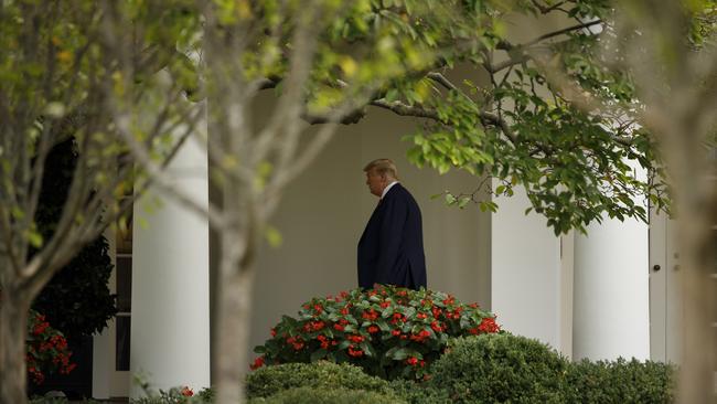 President Donald Trump walks to the Oval Office on Thursday.