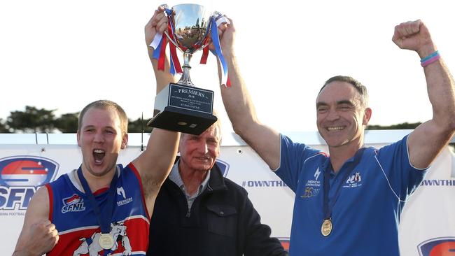 Kieran Knox (left) captain and Jason Heffernan coach of St Paul's celebrate with the trophy after Southern FNL Division 1 grand final: East Malvern v St Paul's on Saturday, September 22, 2018, in Springvale, Victoria, Australia. Picture: Hamish Blair