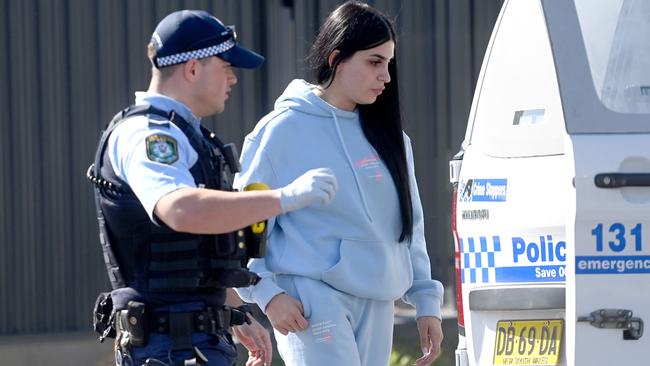 NSW Police arrest Ahmad Alameddine’s sister at a petrol station in Greenacre. Picture: Jeremy Piper