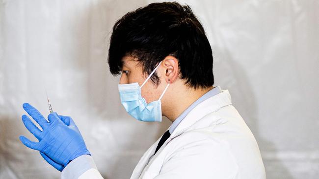 A health worker prepares a Pfizer Covid-19 vaccine in New York. Picture: Kena Betancur / AFP