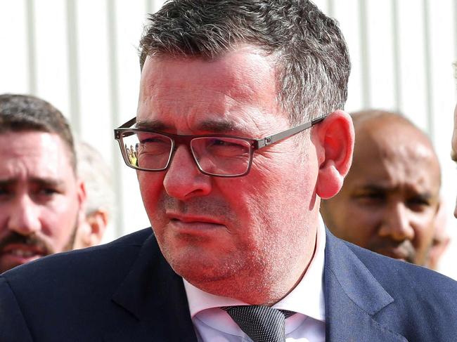 Former Premier of Victoria Daniel Andrews (L) and Fortescue Metals CEO Dino Otranto (R) wait for the arrival of China's Premier Li Qiang at the Fortescue Hazelmere research and development facility in Hazelmere, a suburb of Perth on June 18, 2024. (Photo by COLIN MURTY / POOL / AFP)