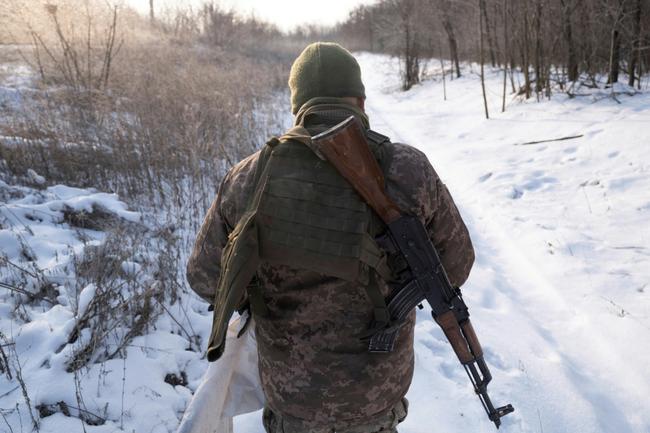 A Ukrainian serviceman walks in an undisclosed location near Kramatorsk, Donetsk region, amid the Russian invasion of Ukraine