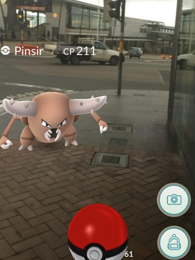 Catching a Pinsir with Liverpool train station in the background.