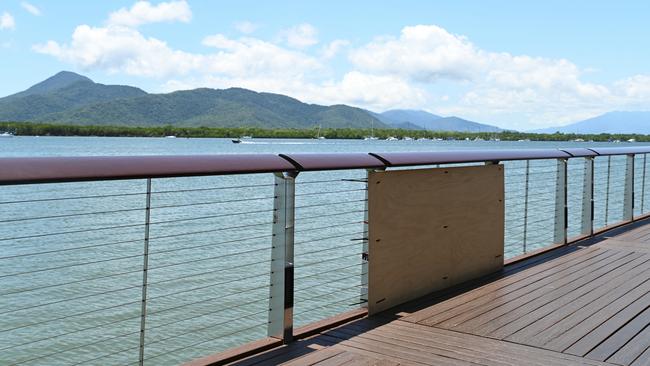 The body of a 26-year-old man was pulled from the waters beneath the Cairns Marlin Marina boardwalk on Tuesday morning. Picture: Isaac McCarthy