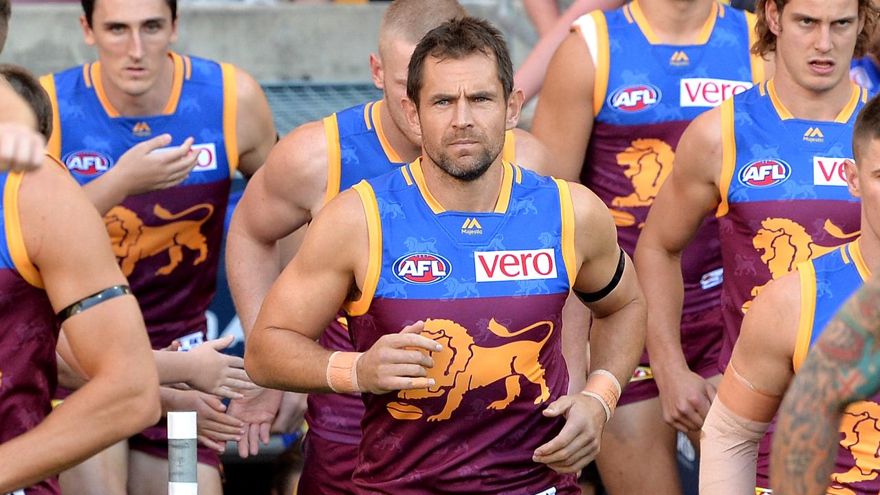 Luke Hodge runs onto the Gabba against Hawthorn last season.