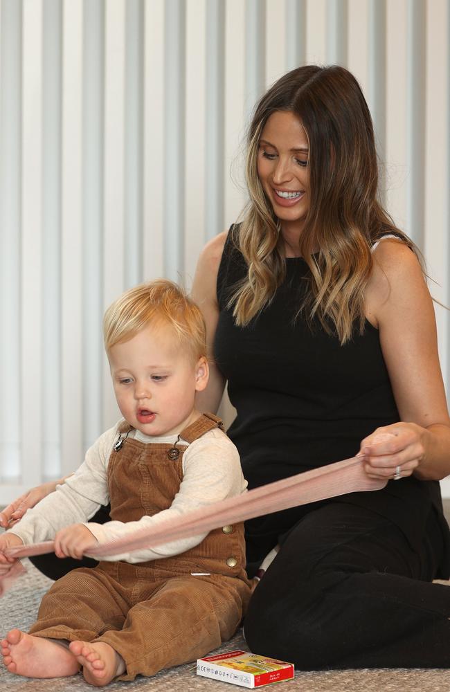 Brit Selwood and son Joey look at some first aid bandages before she does another first aid course ahead of welcoming baby number two. Picture: Alison Wynd