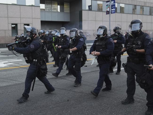 Los Angeles Police Department officers move to disperse a protest. Picture: AP