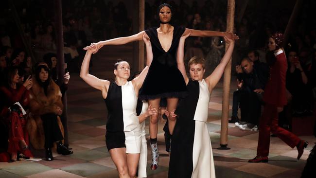 Acrobats performed as models walked the runway. Picture: Francois Guillot/AFP