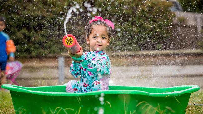 Hot weather in Melbourne. Zoe, 2 yrs, cools off in the backyard. Picture: Jake Nowakowski