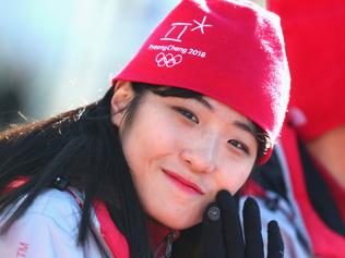 PYEONGCHANG-GUN, SOUTH KOREA - FEBRUARY 01:  Volunter smiles during  the PyeongChang 2018 Olympic Village opening ceremony at the PyeongChang 2018 Olympic Village Plaza on February 1, 2018 in Pyeongchang-gun, South Korea.  (Photo by Alexander Hassenstein/Getty Images)