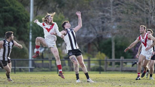 OEFL: Olinda-Ferny Creek’s Chris Darling battles Lachlan Benson of Narre Warren in the ruck. Picture: Valeriu Campan