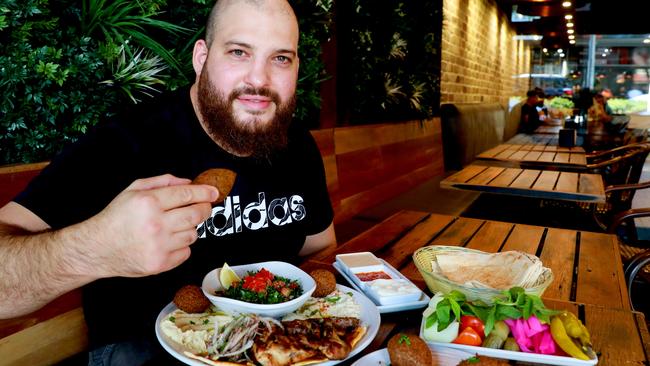 Jasmins Granville owner Abraham Ghazal runs one of the popular eateries on the suburb’s main strip of South St. Picture: Angelo Velardo