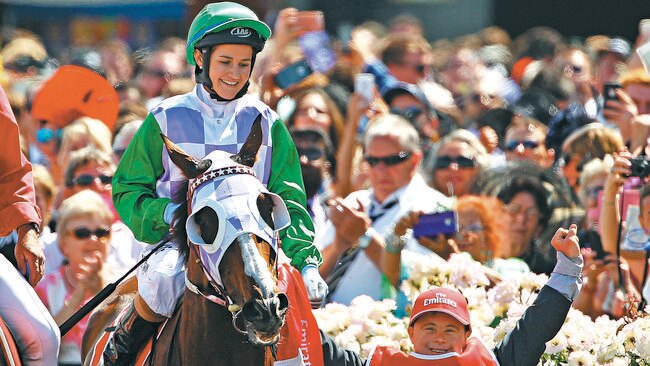 Michelle Payne is congratulated by her brother Steven Payne, who has Down syndrome and works as a strapper after Michelle Payne riding Prince Of Penzance won race 7 the Emirates Melbourne Cup on Melbourne Cup Day at Flemington Racecourse on November 3, 2015 in Melbourne (Photo by Scott Barbour)