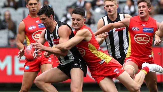 Collingwood midfielder Scott Pendlebury is tackled by Brayden Fiorini. Picture: AAP