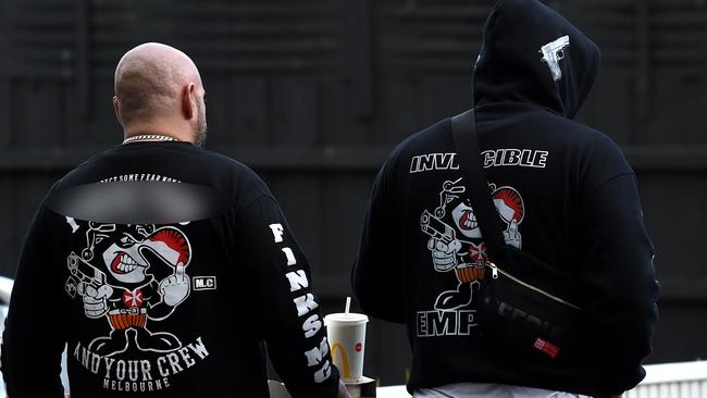 Men wearing Finks bikie jumpers at the scene of the Frankston shooting. Picture: Nicole Garmston