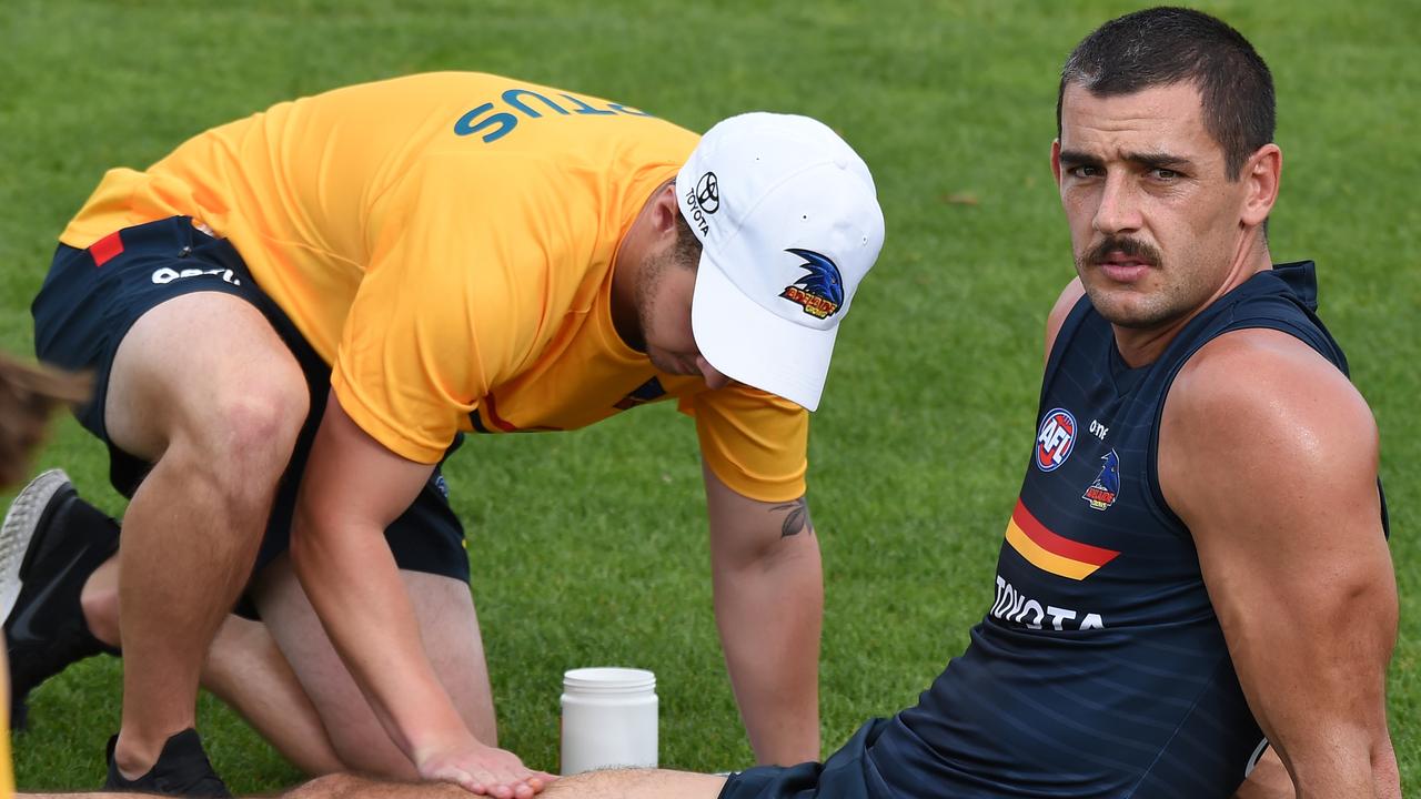 Taylor Walker gets treatment at training. Picture: NCA NewsWire/Naomi Jellicoe