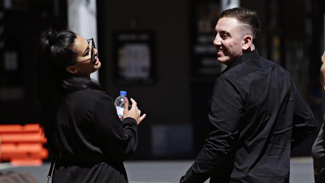 Brandon Thomas Locke-Walker laughs as he leaves Parramatta Local Court with his girlfriend. Picture: Adam Yip