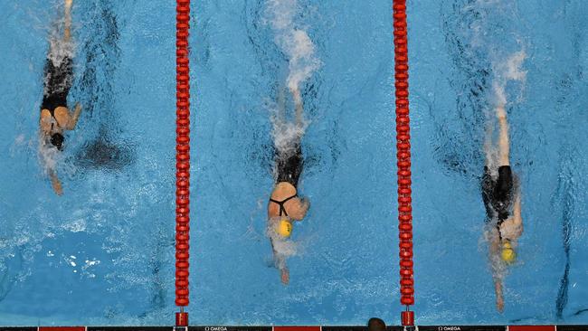 Mollie (right) edges out Ariarne (middle). (Photo by FranÃ§ois-Xavier MARIT / AFP)