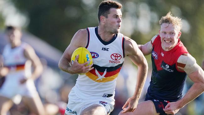 Brad Crouch of the Crows runs with the ball during the AFL Marsh Community Series pre-season match between the Melbourne Demons and Adelaide Crows at Casey Fields in Melbourne, Saturday, February 22, 2020. (AAP Image/Michael Dodge) NO ARCHIVING, EDITORIAL USE ONLY