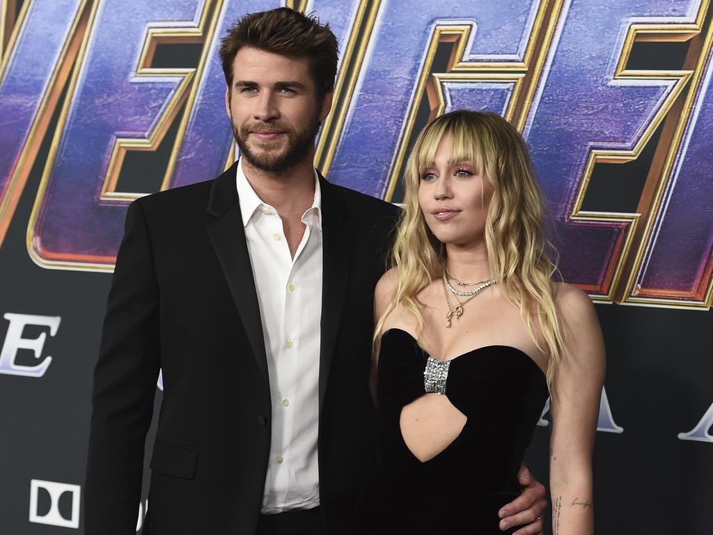 Liam Hemsworth, left, and Miley Cyrus in April 2019. Picture: AP