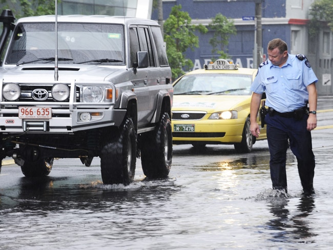 <p>Sen-Sgt Stewart White inspects a passing 4WD on Clarendon Street, in Melbourne's Southbank.</p> <p>Picture: Dave Goudie</p>