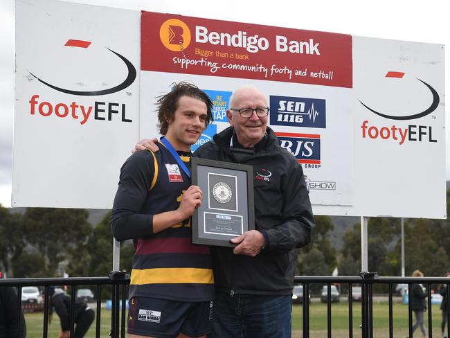 Dylan Viojo-Rainbow collects the Gordon Parker/Blue Ribbon Medal as best afield. Picture: James Ross/AAP