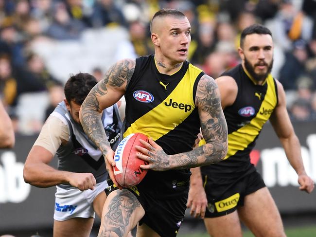 Dustin Martin of the Tigers (second from right) is seen in action during the Round 18 AFL match between the Richmond Tigers and the Port Adelaide Power at the MCG in Melbourne, Saturday, July 20, 2019. (AAP Image/Julian Smith) NO ARCHIVING, EDITORIAL USE ONLY