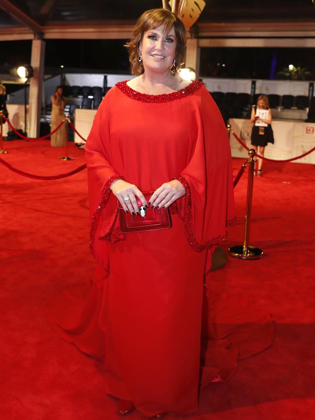 Fellow Gold Logie nominee Tracy Grimshaw in a flowing red number. Picture: AAP Image/Regi Varghese