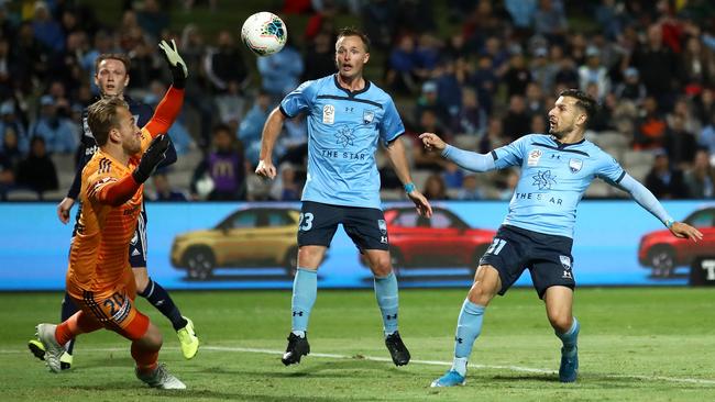 Sydney FC’s Kosta Barbarouses flicks the ball over Melbourne Victory goalkeeper Lawrence Thomas to set up the winning goal at Jubilee Stadium. Picture: Getty Images