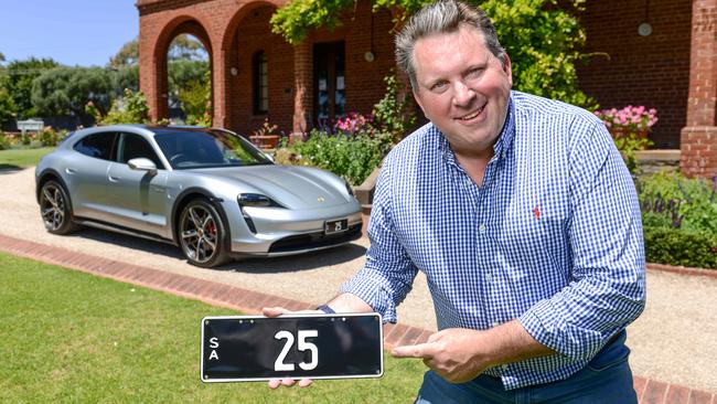 Stewart Kay from Historic Plates with numberplate 25 up for auction. It is worth around the same price as an electric Porsche Taycan 4S. Picture: Brenton Edwards