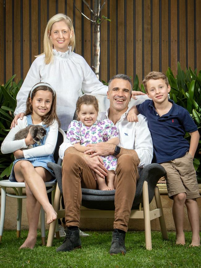 Peter and Annabel Malinauskas surrounded by their children Sophie, 8, holding Charlie the rabbit, Eliza, 3, and Jack, 5, at home. Picture: Emma Brasier