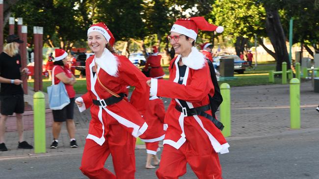 Paula Binks and Heidi Smith-Vaughan at the Darwin Santa Fun Run in July at Mindil Beach. Picture Katrina Bridgeford