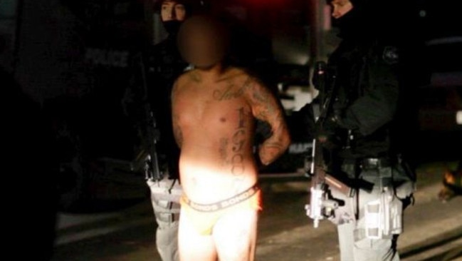 Kemel Barakat, pictured here under arrest in a police raid in 2013. Picture: NSW Police