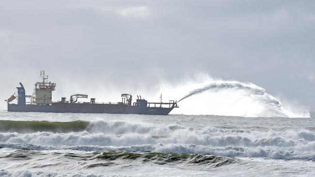 The new 111m dredge replenishing sand on the beach just off Surfers Paradise. Picture: John Gass