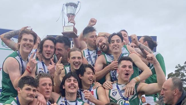 Gembrook Cockatoo players lift the off the 2022 premiership trophy. Picture: Facebook