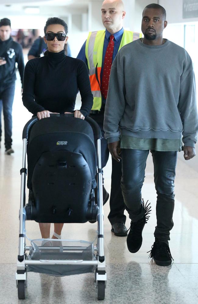 Kim Kardashian and husband Kanye West arrive into Melbourne airport with their baby daughter North.