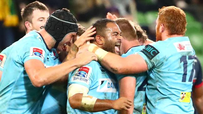 Waratahs players celebrate their win over the Rebels on Friday night. Picture: Getty Images